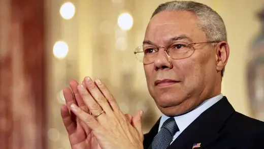 Secretary of State Colin Powell listens as President Bush speaks on trade promotion authority at the Department of State.